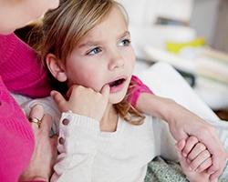 A little girl with a toothache