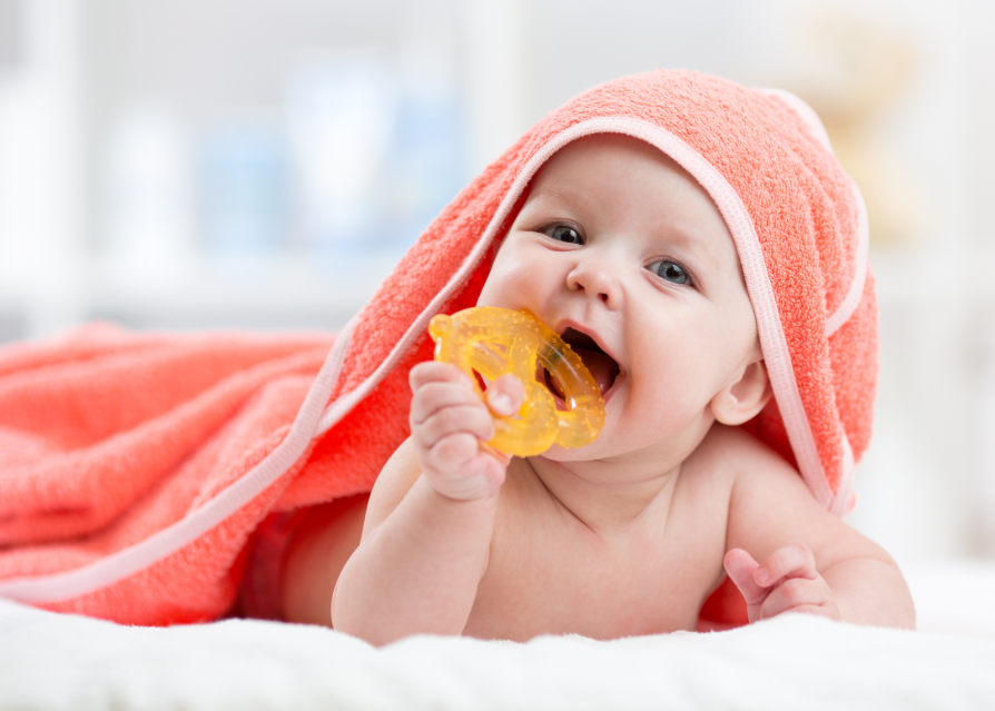 Baby with teething ring